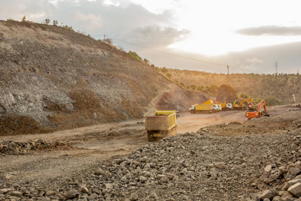 istock Dump truck picks up material at excavation site 2170056953