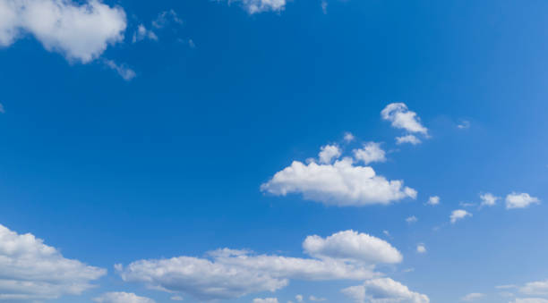 istock blue sky with white cloud background. Clear blue sky and white clouds 2170057572