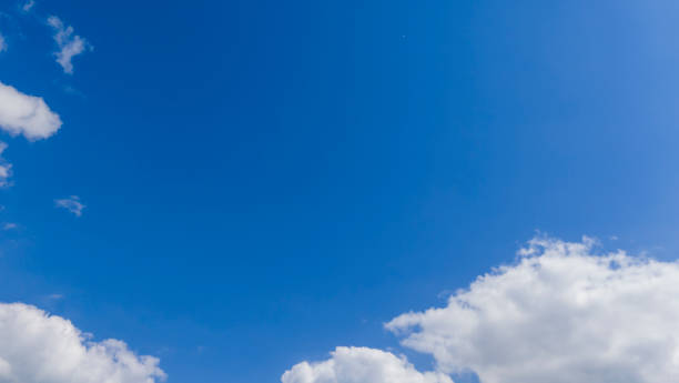 istock blue sky with white cloud background. Clear blue sky and white clouds 2170057621