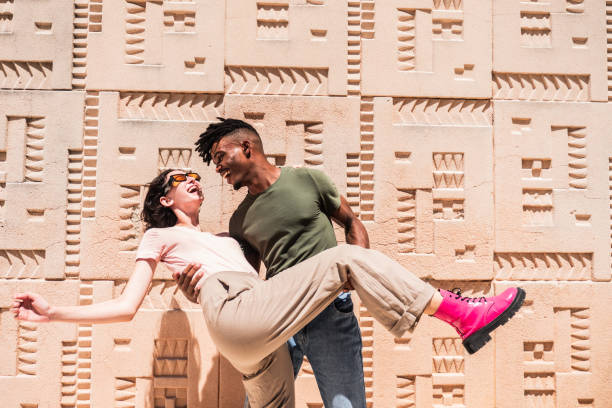 istock Young couple playing outdoors 2170059096