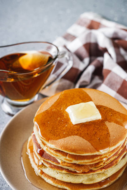 Stack of Sweet Potato Pancakes with Butter and Pecan Nuts