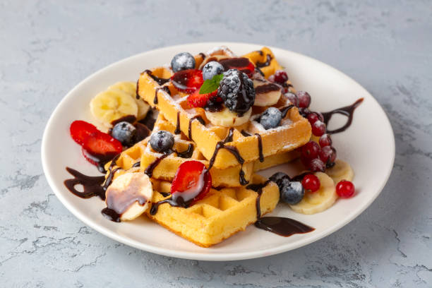 istock Delicious fresh baked belgian waffles with berries and fruit 2170060700