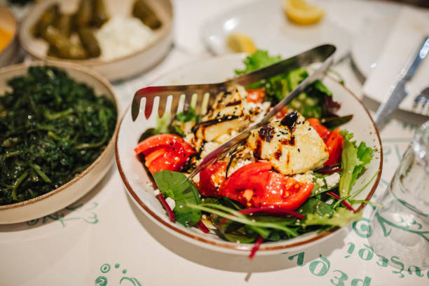 Fresh vegetable salad with grilled halloumi cheese and tomatoes