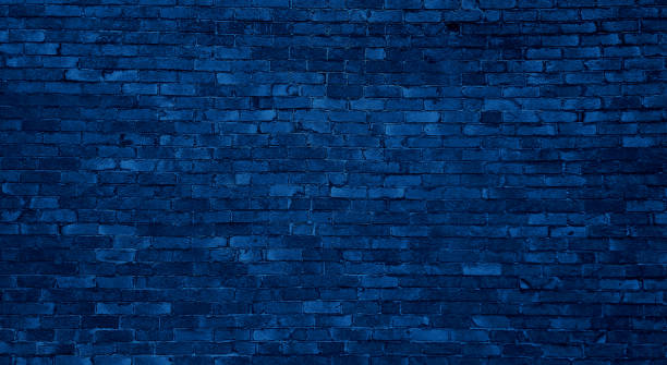 istock old dark blue brick wall of an old architecture building. brick wall texture. navy blue masonry of stone blocks. 2170063324