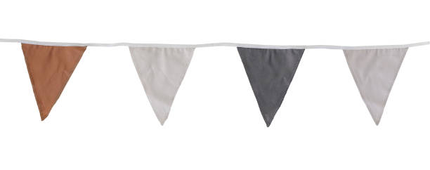 istock Orange, black, white textile bunting flags isolated on white background. Simple pastel fabric birthday garden party flags decor. Summer, autumn or Halloween holiday decoration, festive web banner 2170064040