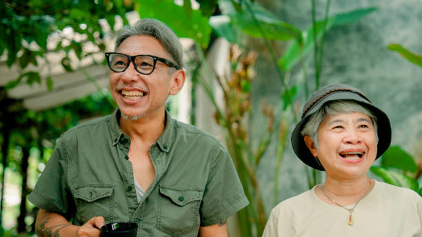 istock Group of retired Asian people enjoying a conversation while reuniting at a cafe. 2170064433