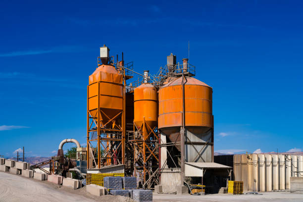 istock Orange Industrial Tanks Against Blue Sky 2170064974
