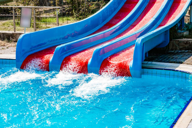 istock blue and red waterslide at aquapark outdoor pool 2170068788