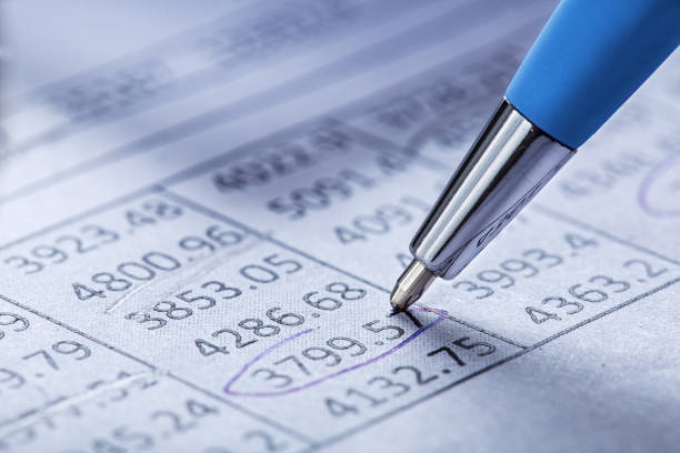 Checking the value of securities. Pencil, share listing and checking financial chart. Concept of banking, financial report and financial audit.