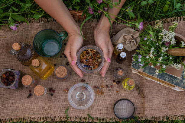 istock woman and herbal tinctures, tea, medicinal herbs. 2170075847