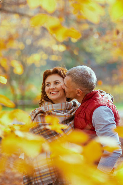 istock smiling modern boyfriend and girlfriend in park kissing 2170077663