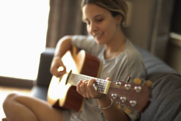 istock Image of a young girl having fun playing guitar. 2170078028