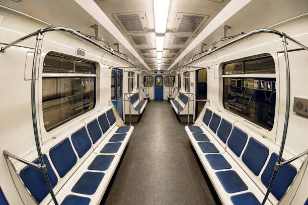 istock An empty car train subway with blue seats inside light interior. Taken with a fisheye lens 2170080676