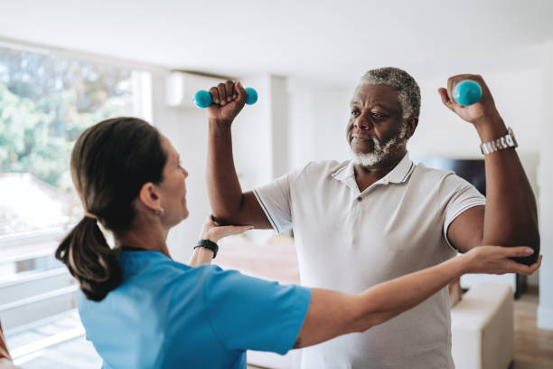 istock Patient at home doing physiotherapy with dumbbell 2170084247