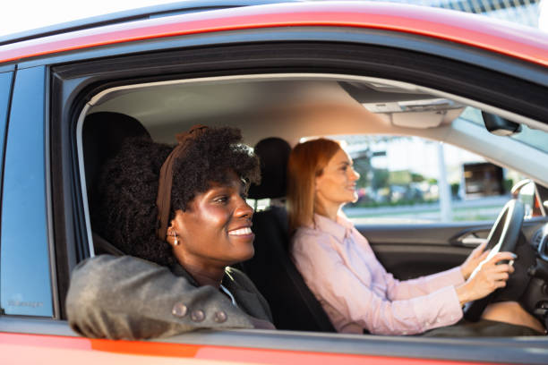 istock Two businesswomen sharing a car ride to work 2170084899