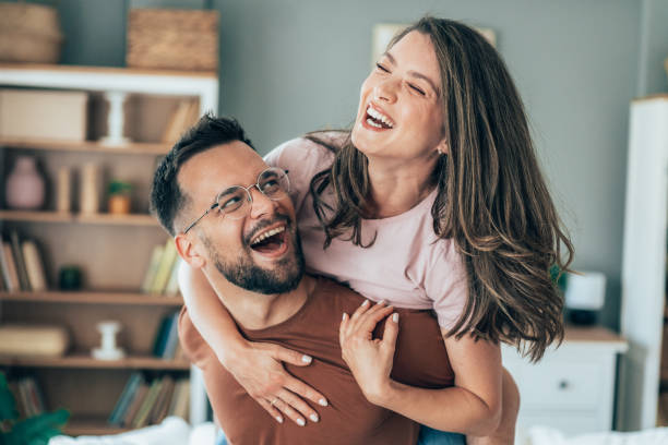 istock Young happy couple piggybacking at home 2170091727