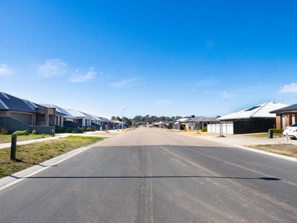 istock Wide street in new housing development 2170092908
