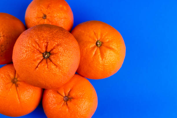 istock Close-up of Oranges on a vibrant blue background 2170094495