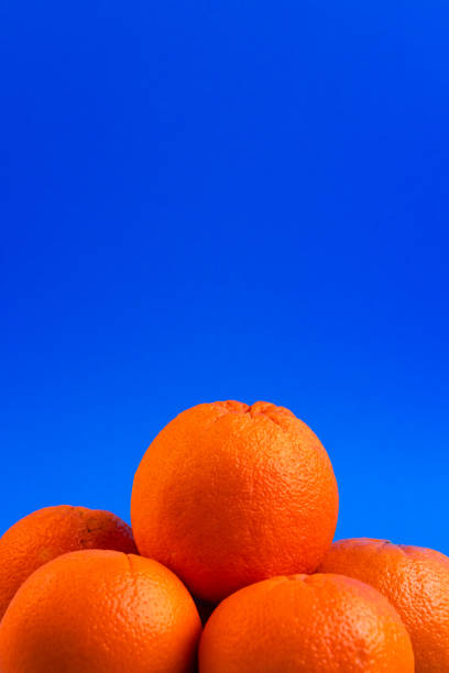 istock Close-up of Oranges on a vibrant blue background 2170095452