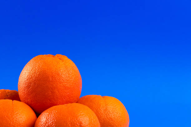 istock Close-up of Oranges on a vibrant blue background 2170095523
