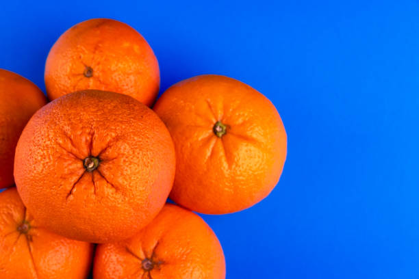 istock Close-up of Oranges on a vibrant blue background 2170095604
