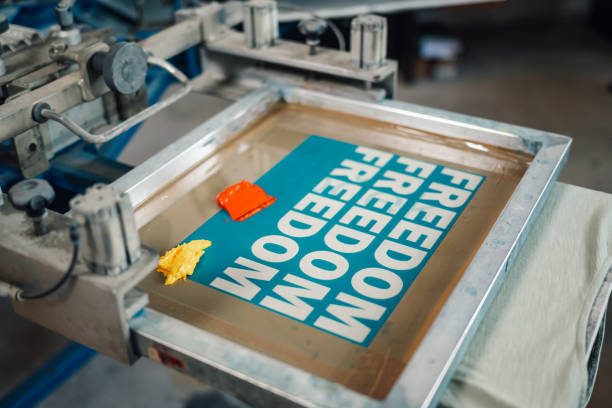 istock Close up of silkscreen printing plate on machine ready for printing 2170097477