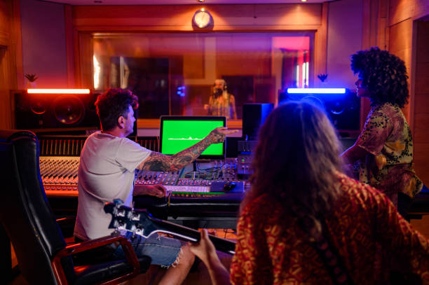 istock Diverse musicians and producer making music at recording studio. 2170097710