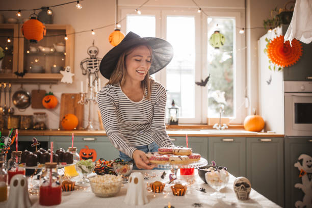 istock Woman preparing food table for Halloween 2170097757