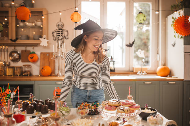 istock Woman preparing food table for Halloween 2170097762