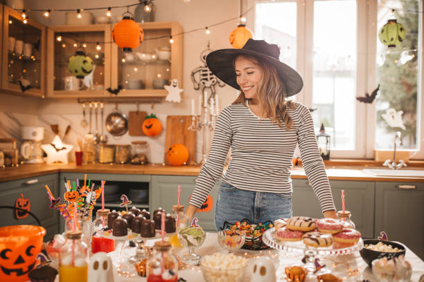 istock Woman preparing food table for Halloween 2170097766