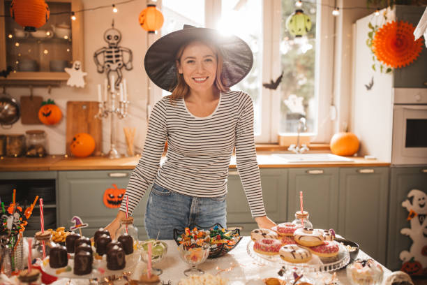 istock Woman preparing food table for Halloween 2170097767