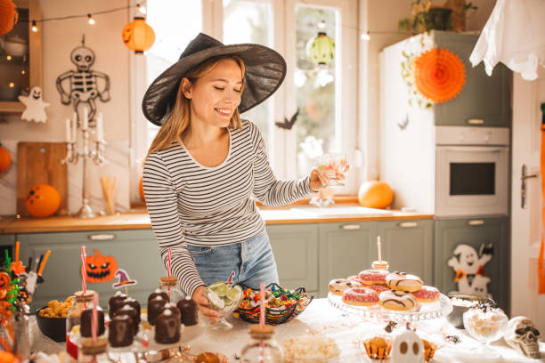 istock Woman preparing food table for Halloween 2170097768