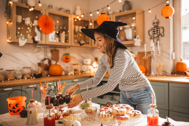 istock Woman preparing food table for Halloween 2170097769