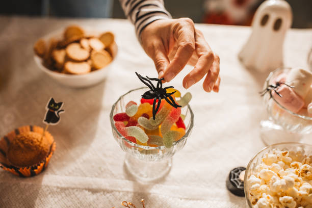 istock Woman preparing food table for Halloween 2170097780