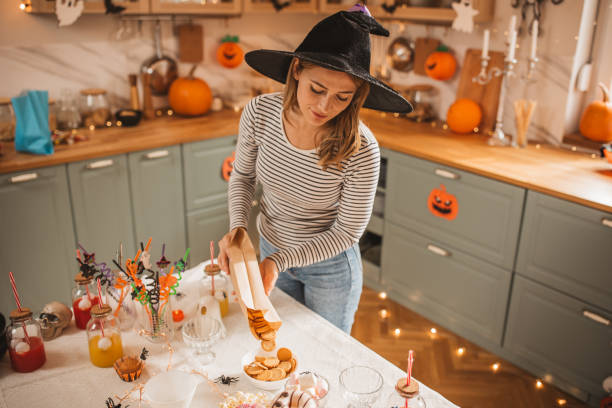 istock Woman preparing food table for Halloween 2170097781