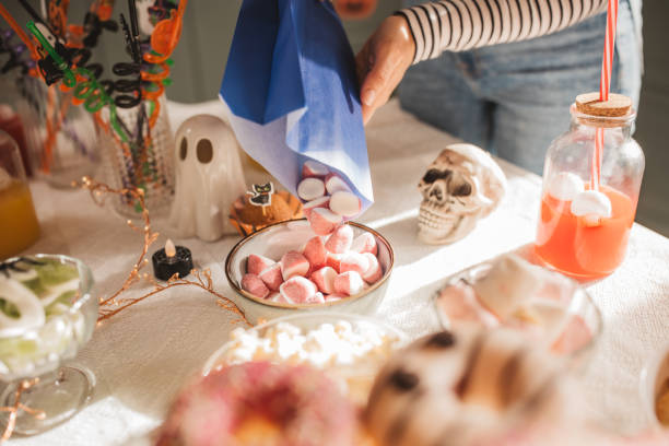 istock Woman preparing food table for Halloween 2170097785