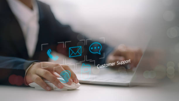 istock Customer support hotline Contact us people connection. Businessmen using laptops with email, cell phone, address, and Chat message icons. 2170099177