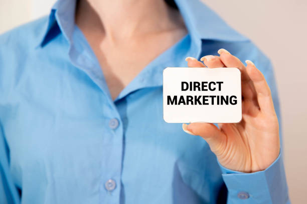 istock businessman holding a card with text direct marketing 2170102001