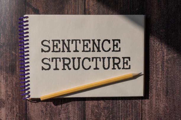 istock SENTENCE STRUCTURE - words in a white notepad on the background of a laptop with pencils. 2170102005