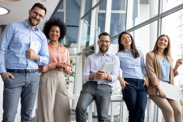 istock Team of professionals laughing together 2170103123