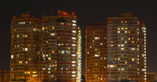 istock Light in the windows of a high-rise building 2170104349