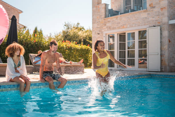 istock Diverse Group by the Pool with Jumping Girl 2170105718