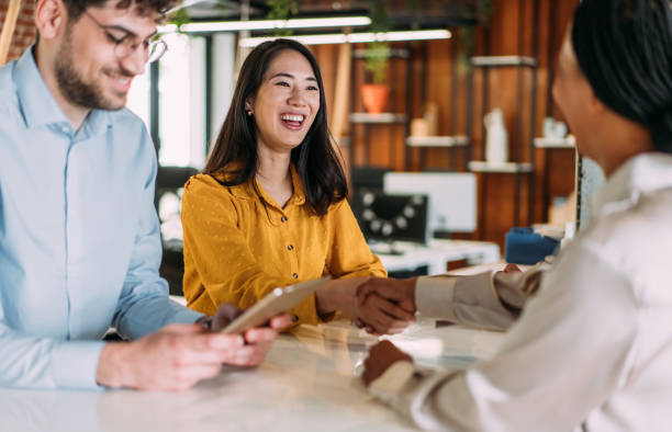 istock Businesswomen shaking hands across the table. 2170109540