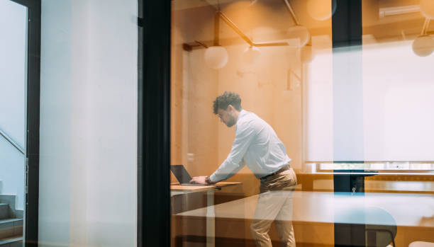 istock Businessman working in an isolated booth at the office. 2170109606