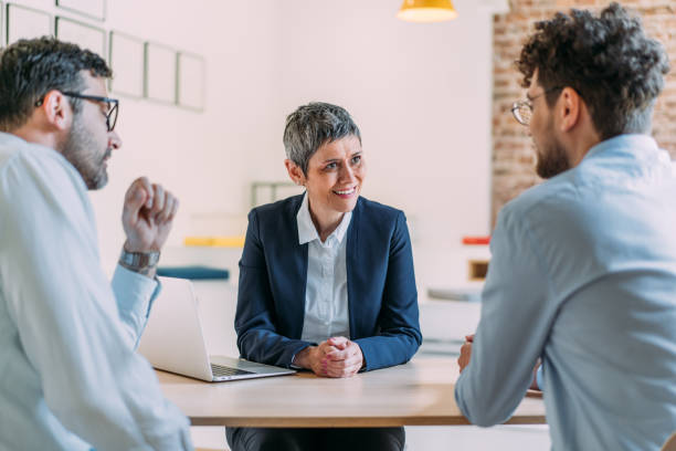 istock Group of business persons talking in the office. 2170109611