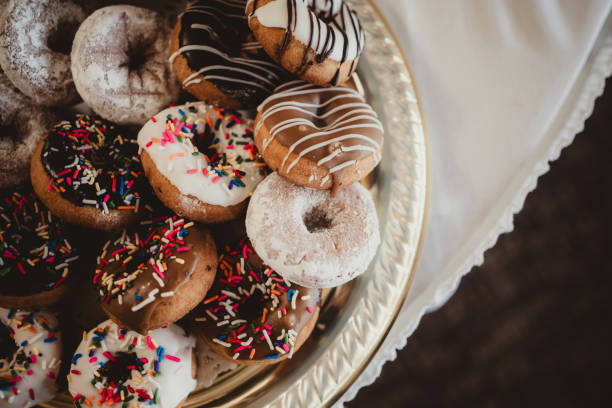 Platter of doughnuts with frosting icing and sprinkles