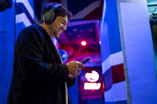 istock millennial man digitally connected with his smartphone and headphones 2170116323