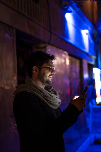 istock Young man using his smartphone to talk to his friends 2170116325
