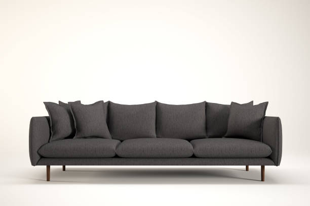 istock Gray sofa with wooden legs with several pillows on it. 2170116371