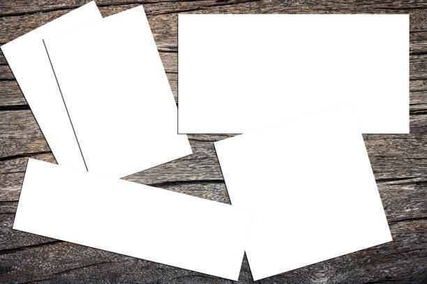 istock Blank paper cards placed on the old wood plank 2170118757